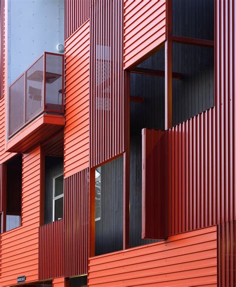 decorative metal facade front of house|curbside front of house.